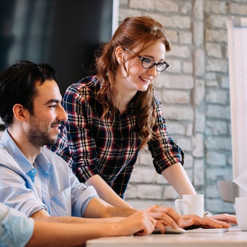 Software engineers working on project and programming in company